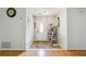 Inviting foyer with hardwood floors, neutral paint, and a white front door that lets in lots of natural light at 1921 Flint Hill Dr, Lawrenceville, GA 30044