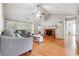 Spacious living room features vaulted ceilings, hardwood floors, fireplace, lots of light from large windows at 1921 Flint Hill Dr, Lawrenceville, GA 30044