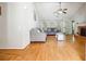 Bright living room with vaulted ceiling, hardwood floors, ceiling fan, a fireplace and lots of natural light at 1921 Flint Hill Dr, Lawrenceville, GA 30044