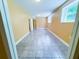 Finished basement with tiled flooring and a window bringing in natural light at 241 Sarann Nw Ct, Lilburn, GA 30047