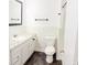 Classic white bathroom featuring tile flooring, a toilet, and a shower at 241 Sarann Nw Ct, Lilburn, GA 30047