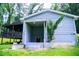 Back of house with basement entrance and covered deck at 241 Sarann Nw Ct, Lilburn, GA 30047