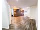 Spacious living room with modern wood accent wall, hardwood floors, and recessed lighting at 241 Sarann Nw Ct, Lilburn, GA 30047