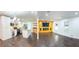 Open-concept with a modern kitchen and living room with hardwood floors and a fireplace at 241 Sarann Nw Ct, Lilburn, GA 30047
