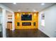 Inviting living room with a modern entertainment center, fireplace, and recessed lighting at 241 Sarann Nw Ct, Lilburn, GA 30047