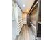 Large walk-in closet with custom shelving and wood-paneled walls at 241 Sarann Nw Ct, Lilburn, GA 30047
