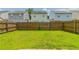 This is a well-kept backyard space with a wooden fence at 256 Turnstone Rd, Stockbridge, GA 30281