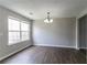 Bright dining area with large window and modern chandelier at 256 Turnstone Rd, Stockbridge, GA 30281
