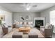 Comfortable living room with stylish furniture, neutral decor, and a fireplace at 256 Turnstone Rd, Stockbridge, GA 30281