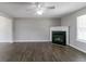 Inviting living room with fireplace, dark wood floors and plenty of space at 256 Turnstone Rd, Stockbridge, GA 30281