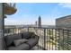 Relaxing outdoor balcony with comfortable seating and stunning city views at 400 W Peachtree Nw St # 3114, Atlanta, GA 30308