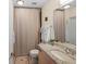 Bathroom featuring granite counters, decorative rugs, and well-lit mirror at 400 W Peachtree Nw St # 3114, Atlanta, GA 30308