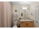 Bright bathroom with granite countertops, white towels and neutral shower curtain at 400 W Peachtree Nw St # 3114, Atlanta, GA 30308