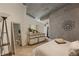 Cozy bedroom with stylish dresser, decor, concrete ceilings, and ample natural light at 400 W Peachtree Nw St # 3114, Atlanta, GA 30308