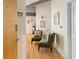 Inviting hallway with hardwood floors, cozy seating area, and stylish decor at 400 W Peachtree Nw St # 3114, Atlanta, GA 30308