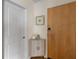 Neutral hallway with wooden accents including wood door, wood floors, and wood cabinet at 400 W Peachtree Nw St # 3114, Atlanta, GA 30308
