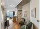 Hallway with modern accents leading to kitchen and living area, hardwood floors and stylish decor at 400 W Peachtree Nw St # 3114, Atlanta, GA 30308