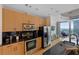 Contemporary kitchen with stainless appliances, dark countertops, and stunning city view at 400 W Peachtree Nw St # 3114, Atlanta, GA 30308