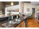 Modern kitchen featuring sleek countertops, stainless steel sink, stylish fixtures, and view to living area at 400 W Peachtree Nw St # 3114, Atlanta, GA 30308