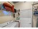 Functional laundry room with shelving, washer, and dryer at 400 W Peachtree Nw St # 3114, Atlanta, GA 30308