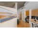 Open-concept living area with hardwood floors, modern art, and a convenient built-in workspace at 400 W Peachtree Nw St # 3114, Atlanta, GA 30308