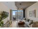 Bright living room with contemporary decor, large windows, and access to balcony with city view at 400 W Peachtree Nw St # 3114, Atlanta, GA 30308