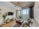 Cozy living room with contemporary design, floor to ceiling windows, and access to balcony at 400 W Peachtree Nw St # 3114, Atlanta, GA 30308