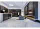 Grand lobby area with a front desk, decorative wall panel, and contemporary fireplace at 400 W Peachtree Nw St # 3114, Atlanta, GA 30308