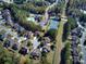 Aerial view of a neighborhood featuring single-Gathering homes, mature trees, and sidewalks at 122 White Spruce Ct, Dallas, GA 30157