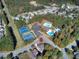 Aerial view showcasing community amenities including tennis courts and swimming pool at 122 White Spruce Ct, Dallas, GA 30157