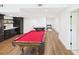 Finished basement featuring a billiards table and a kitchenette area with stainless steel appliances at 122 White Spruce Ct, Dallas, GA 30157