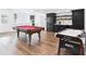 Finished basement featuring a billiards table, air hockey, and a kitchenette area at 122 White Spruce Ct, Dallas, GA 30157