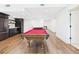 Finished basement featuring a billiards table and a kitchenette area with sleek cabinets at 122 White Spruce Ct, Dallas, GA 30157