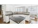 Well-equipped kitchen featuring granite countertops, a central island, and convenient access to the dining area at 122 White Spruce Ct, Dallas, GA 30157