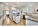 Spacious kitchen offering modern appliances, a central island, and seamless flow into the dining and living spaces at 122 White Spruce Ct, Dallas, GA 30157