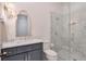 Stylish bathroom showcasing a modern vanity, marble countertops, and a glass-enclosed shower with mosaic tile at 235 Founders Mill Ct, Roswell, GA 30075