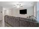 Bright living room featuring a large gray couch, recessed lighting, and large windows at 370 Cassidy Trl, Douglasville, GA 30134
