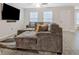 Comfortable living room featuring a large television, plush seating, and modern wood flooring at 370 Cassidy Trl, Douglasville, GA 30134
