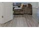 Cozy living room with hardwood flooring, comfortable sofa, and open view to the kitchen at 370 Cassidy Trl, Douglasville, GA 30134
