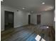 Large basement area with modern flooring, recessed lights, and open doorways at 515 Allens Landing Ct, Lawrenceville, GA 30045