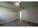 Finished basement showcasing updated gray wood floors, neutral paint, and access to other rooms at 515 Allens Landing Ct, Lawrenceville, GA 30045