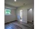 Finished basement features a window for natural light and an open doorway to the renovated bathroom at 515 Allens Landing Ct, Lawrenceville, GA 30045