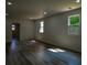 Generous basement area features modern gray flooring, windows, and lighting at 515 Allens Landing Ct, Lawrenceville, GA 30045