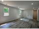 Open basement area featuring new flooring, windows, and a door at 515 Allens Landing Ct, Lawrenceville, GA 30045