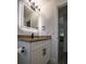 Stylish bathroom with illuminated mirror, granite countertop vanity, and modern fixtures at 515 Allens Landing Ct, Lawrenceville, GA 30045