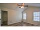Spacious bedroom with two windows, ceiling fan and stylish flooring at 515 Allens Landing Ct, Lawrenceville, GA 30045