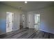 Bedroom showcasing modern floors and access to a tiled bathroom at 515 Allens Landing Ct, Lawrenceville, GA 30045