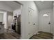 Entryway with hardwood floors, white walls, and a view of the kitchen at 515 Allens Landing Ct, Lawrenceville, GA 30045