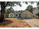 Charming exterior view of home with a two-car garage and updated landscaping at 515 Allens Landing Ct, Lawrenceville, GA 30045