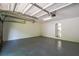 Spacious two-car garage with epoxy flooring, insulated garage door and new lighting fixtures at 515 Allens Landing Ct, Lawrenceville, GA 30045